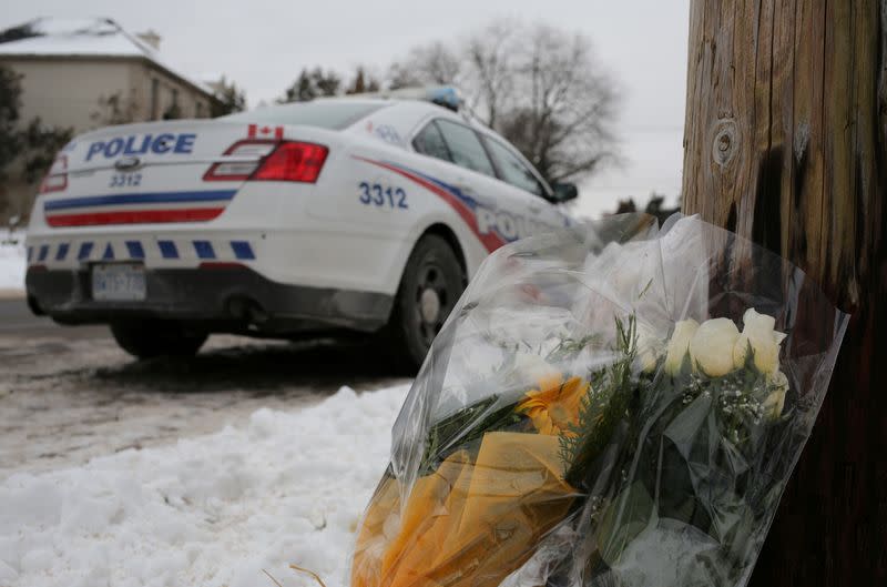 FILE PHOTO: Flowers from mourners are seen outside the home of billionaire founder of Canadian pharmaceutical firm Apotex in Toronto