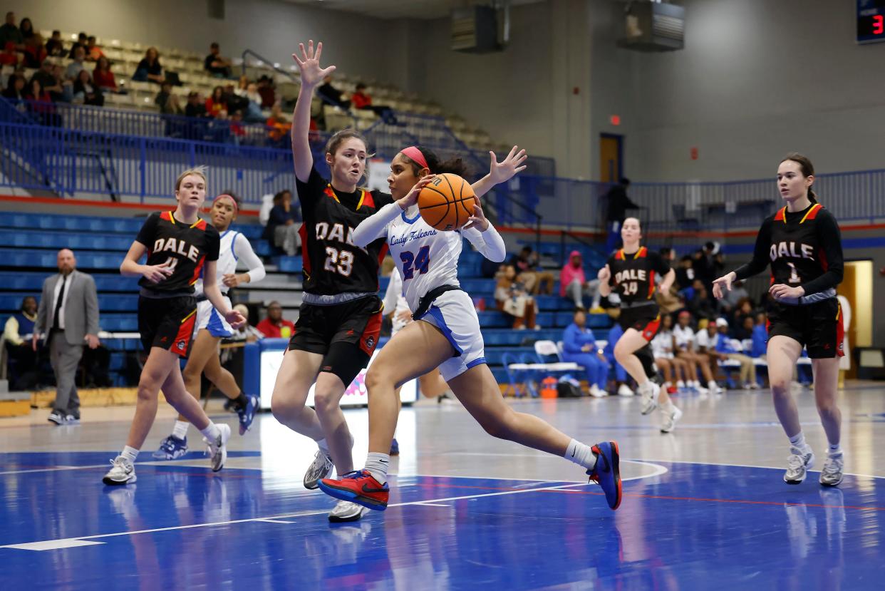 Millwood's Reighan Carey (24) drives the ball against Dale's Gracie Redford (23) during a high school basketball game, Tuesday, Jan. 23, 2024, at Millwood High School in Oklahoma City.