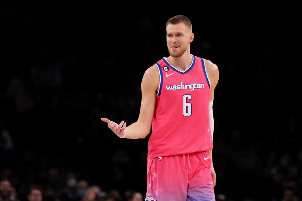 Kristaps Porzingis #6 of the Washington Wizards reacts after hitting a three point basket during the first half against the Brooklyn Nets at Barclays Center in NBA game