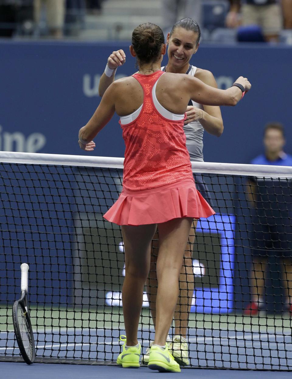 Flavia Pennetta of Italy (rear) hugs compatriot Roberta Vinci after Pennetta won their women's singles finals match at the U.S. Open Championships tennis tournament in New York, September 12, 2015. REUTERS/Brendan McDermid