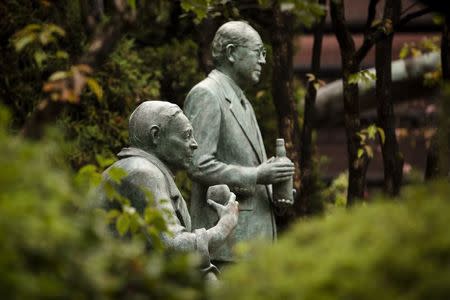 A monument to distillery founder Shinjiro Torii and his son, Keizo Saji, its second generation master blender, stands in the compound of Suntory Holdings' Yamazaki Distillery in Shimamoto town, Osaka prefecture, near Kyoto, December 1, 2014. REUTERS/Thomas Peter