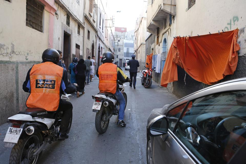 This Saturday April 26, 2014 photo shows Moroccan police officers patrolling in a street of Derb El Kabir, a fief of crime and drugs in Casablanca, Morocco. As home to most of Morocco’s economy, as well as most its slums, Casablanca in particular has always had a crime problem. It is a city of extremes, with skyscrapers and highend nightlife on one hand and the other the crushing poverty that spawned the angry youth who killed 33 people in a spate of bombings in 2003.(AP Photo / Abdeljalil Bounhar)