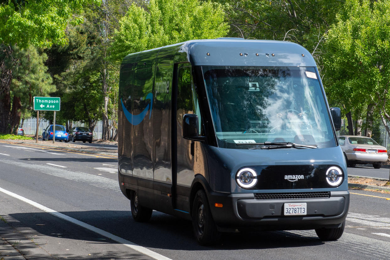 10 May 2023, USA, Palo Alto: An electric delivery truck specially developed for Amazon by the manufacturer Rivian is on the road in Silicon Valley. More than 300 similar vehicles are to hit the roads in Germany in the coming weeks. (to dpa: 