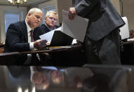 Defense attorney Jim Griffin, left, looks over evidence alongside Alex Murdaugh, center, in Murdaugh's double murder trial at the Colleton County Courthouse in Walterboro, S.C., Friday, Feb. 3, 2023. The 54-year-old attorney is standing trial on two counts of murder in the shootings of his wife and son at their Colleton County home and hunting lodge on June 7, 2021. (Andrew J. Whitaker/The Post And Courier via AP, Pool)