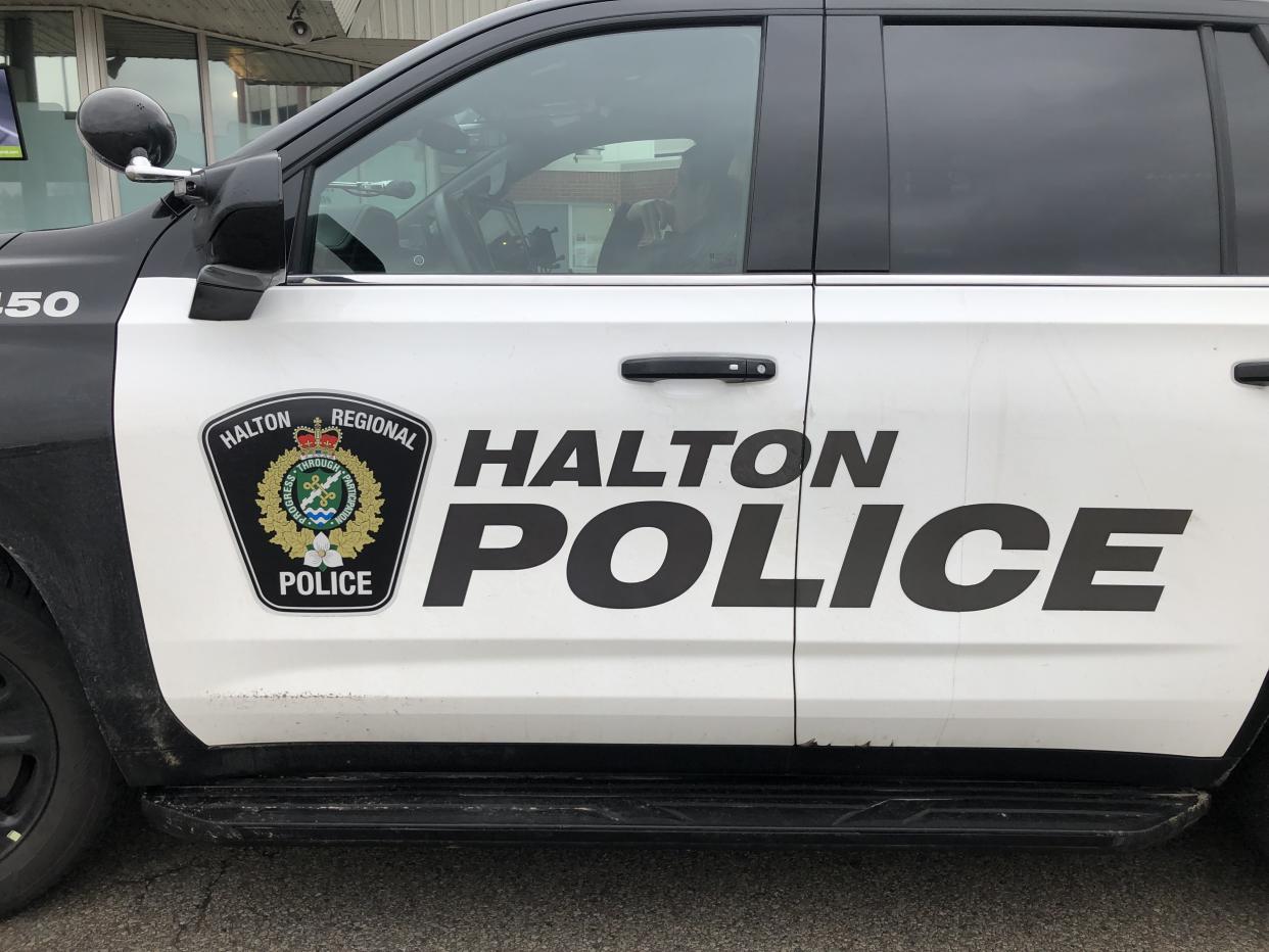 A Halton Regional Police vehicle is shown in Oakville, Ont., Wednesday, Jan.18, 2023. Halton Regional police say they have arrested a woman alleged to have thrown an unknown chemical on her family member and stolen her phone last week in Milton, Ont. THE CANADIAN PRESS/Richard Buchan