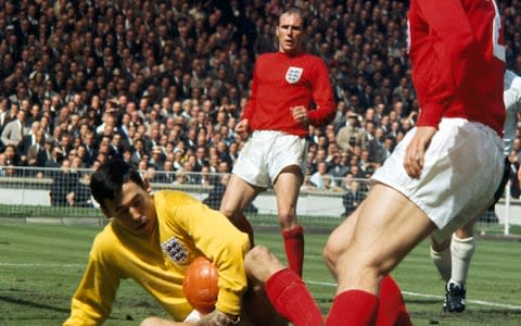 Gordon Banks holds onto the ball, watched by Ray Wilson - Credit: Rolls Press/Popperfoto