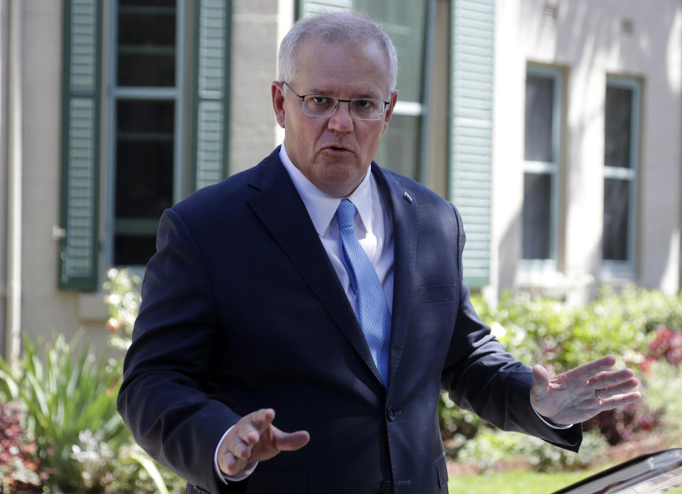 Australia's Prime Minister Scott Morrison speaks to the media in Sydney, Monday, March 1, 2021. Morrison stood by an unnamed Cabinet minister against calls for him to step down from office over an allegation that he raped a 16-year-old girl more than 30 years ago. (AP Photo/Rick Rycroft)