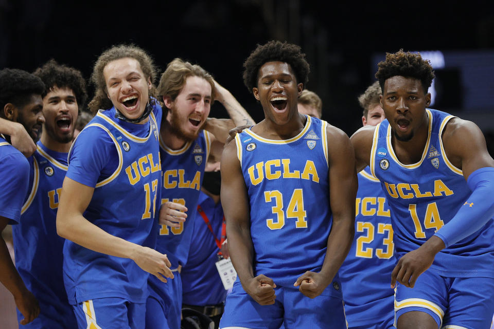 INDIANAPOLIS, INDIANA - MARCH 28: The UCLA Bruins celebrate after defeating the Alabama Crimson Tide in the Sweet Sixteen round game of the 2021 NCAA Men's Basketball Tournament at Hinkle Fieldhouse on March 28, 2021 in Indianapolis, Indiana. (Photo by Sarah Stier/Getty Images)
