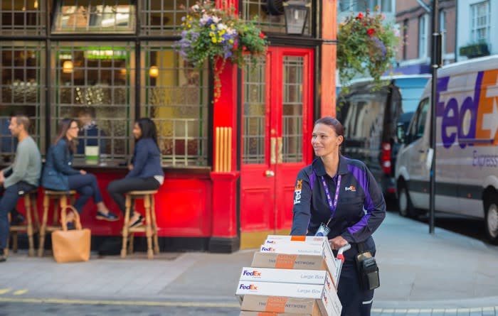 FedEx deliverywoman with boxes