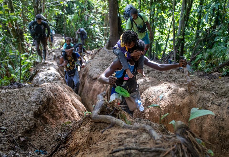 Migrants, most from Haiti, journey through the infamous Darien Gap enroute towards the United States