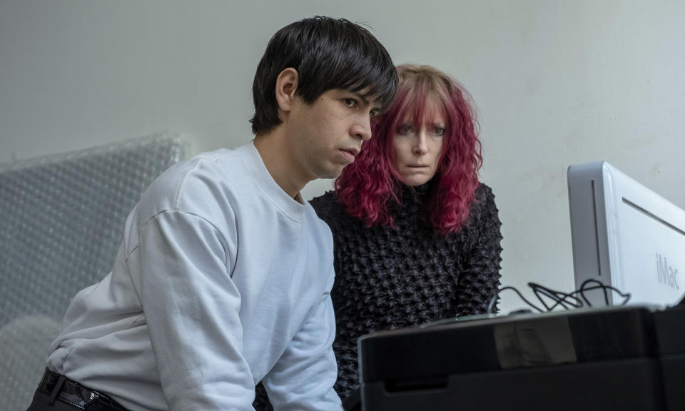 This image released by A24 Films shows Julio Torres, left, and Tilda Swinton in a scene from "Problemista." (Jon Pack/A24 via AP)