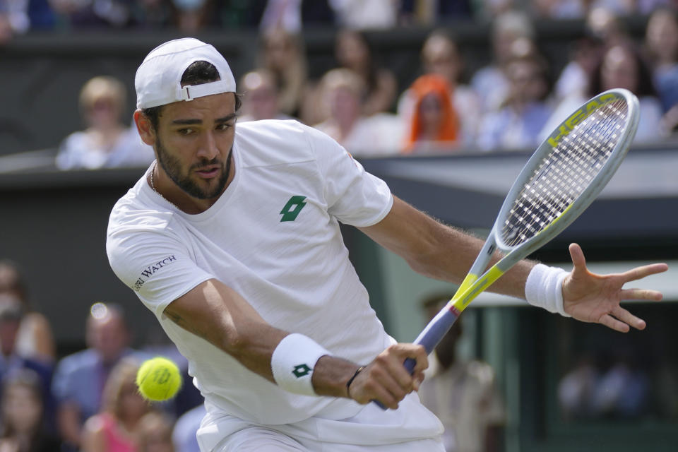 FILE - Italy's Matteo Berrettini plays a return to Serbia's Novak Djokovic during the men's singles final on day thirteen of the Wimbledon Tennis Championships in London, in this Sunday, July 11, 2021, file photo. Berrettini is seeded for the U.S. Open, the year's last Grand Slam tennis tournament. Play in the main draw begins in New York on Monday, Aug. 30.(AP Photo/Kirsty Wigglesworth, File)