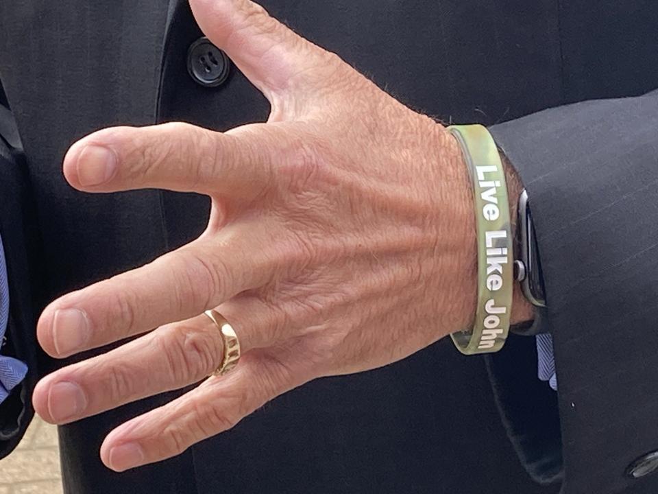 Wendall Pelham, wears a bracelet in memory of his son, Spc. John Pelham, during a U.S. Army Special Operations Command memorial ceremony Thursday, May 25, 2023, at Fort Bragg.