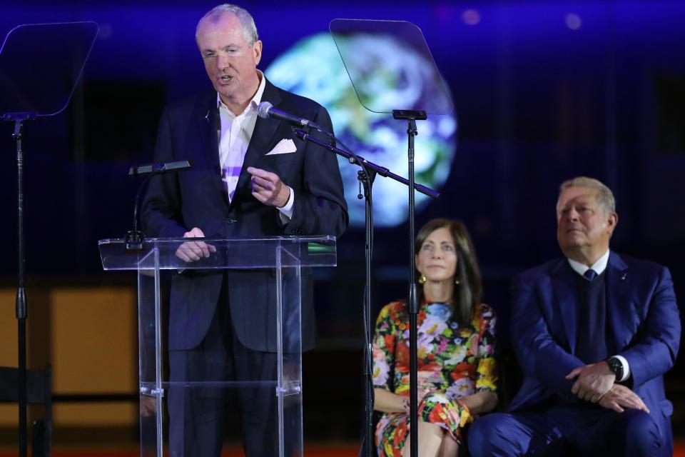 New Jersey Gov. Phil Murphy, with first lady Tammy Murphy and former Vice President Al Gore, speaks Tuesday before signing an executive order to increase the state's offshore wind-generated electricity.