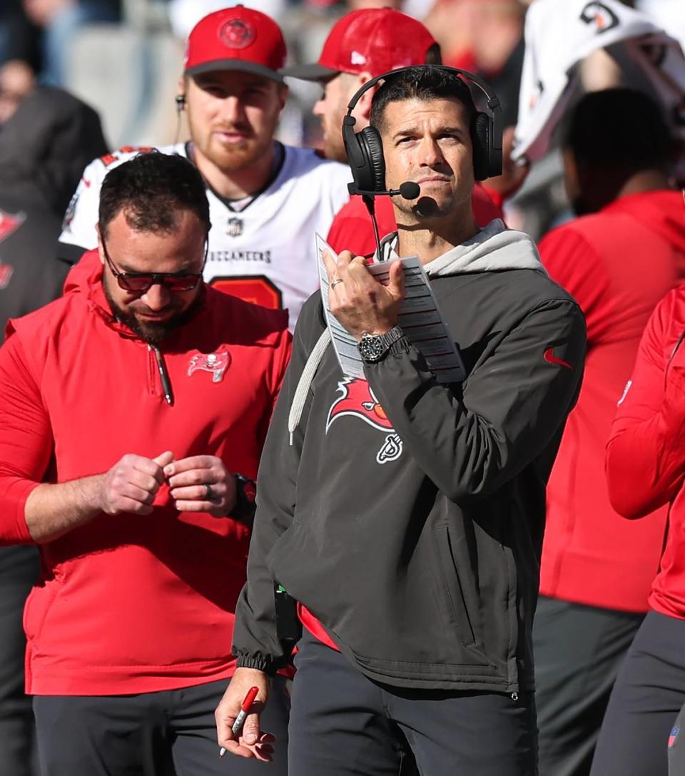 Tampa Bay Buccaneers offensive coordinator Dave Canales, center, stands along the team’s sideline during action against the Carolina Panthers at Bank of America Stadium in Charlotte, NC on Sunday, January 7, 2024. Canales was named the team’s head coach 18 days later.