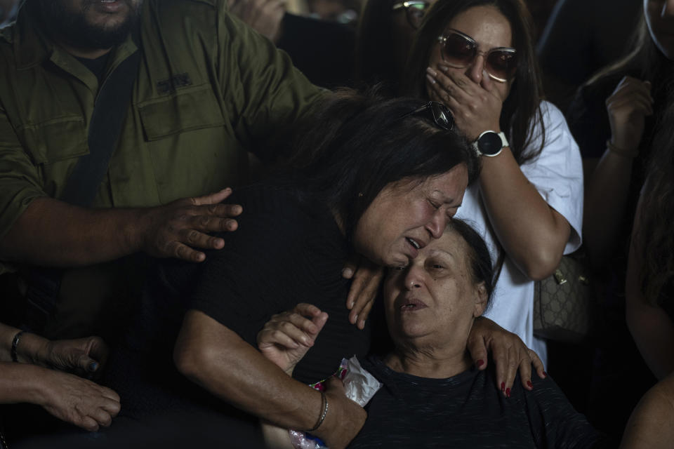 Mourners attend the funeral of the Israeli woman Shiraz Tamam, killed by Hamas militants while attending a music festival at a cemetery in Holon, central Israel, Tuesday, Oct. 17, 2023. (AP Photo/Petros Giannakouris)