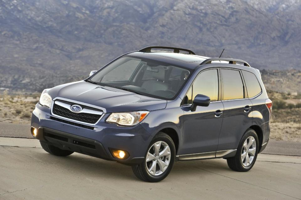 FILE - This publicity file photo provided by Subaru shows the 2014 Subaru Forester, well known as a durable and eminently functional compact sport utility vehicle, adds more power, more room, more safety features and a retuned suspension for 2014. The new, fourth-generation Forester also has higher fuel economy ratings than its predecessor, 24 miles per gallon in city driving and 32 mpg on the highway with base, 170-horsepower, four-cylinder engine and fuel-efficient continuously variable transmission (CVT). (AP Photo/Subaru, File)