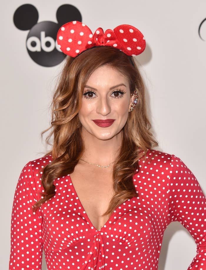 Close-up of Anneliese wearing Mickey Mouse ears at a media event