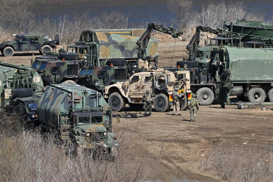 South Korean and US military vehicles are seen at a military training field in the border city of Yeoncheon on March 13, 2023. - South Korea and the United States kicked off the Freedom Shield joint military exercise, their largest drills in five years, which will run for 10 days from March 13, 2023 as part of the allies drive to counter North Korea's growing threats. (Photo by Jung Yeon-je / AFP) (Photo by JUNG YEON-JE/AFP via Getty Images)