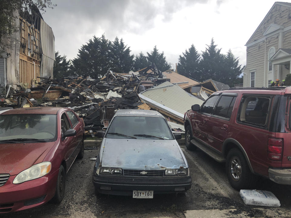 The site of a fire in Woodlawn, Md., where three people were killed, including a suspect, and two others were injured on Saturday, May 8, 2021. (AP Photo/Brian Witte)