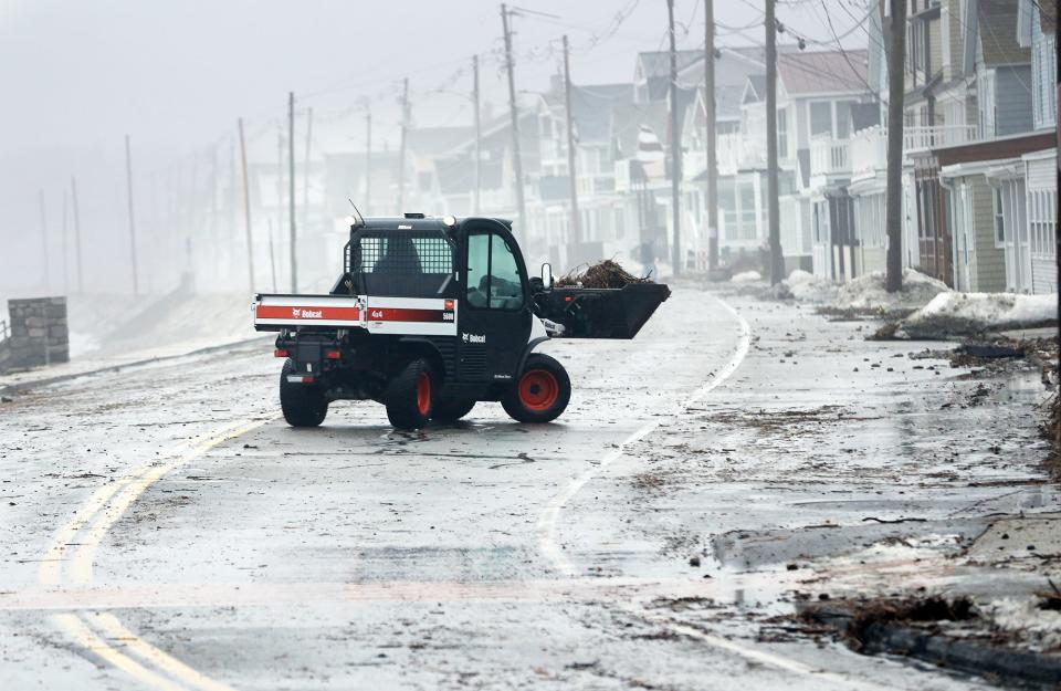 The stretch of road along Long Sands Beach in York, Maine, was closed down following high tide so debris could be removed Monday, Jan. 17, 2022.