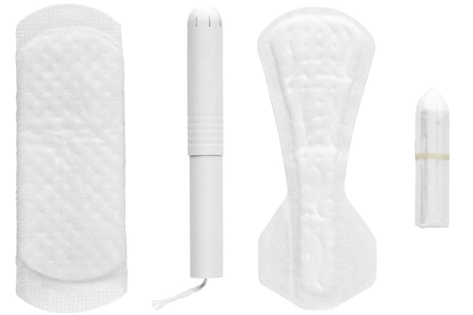 Selection of woman's hygiene items, on white background, cut out