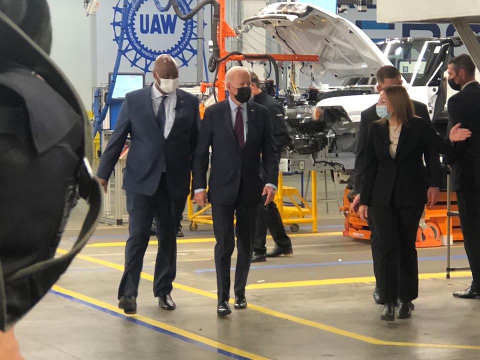 President Joe Biden, center, tours GM's Factory ZERO plant with UAW President Ray Curry (to Biden's right) and GM CEO Mary Barra (to Biden's left) on Nov. 17, 2021.