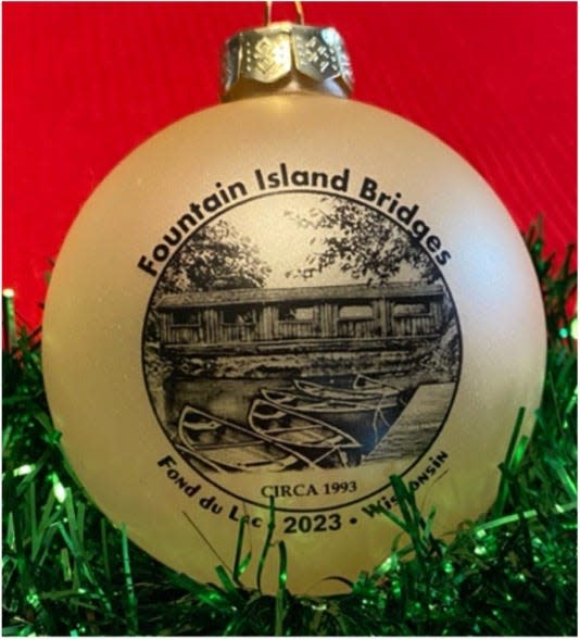 Soroptimist International of Fond du Lac, a local service organization, is offering Bridges of Fountain Island as its 34th Landmark Ornament. Pictured is the covered wooden bridge side of the ornament.