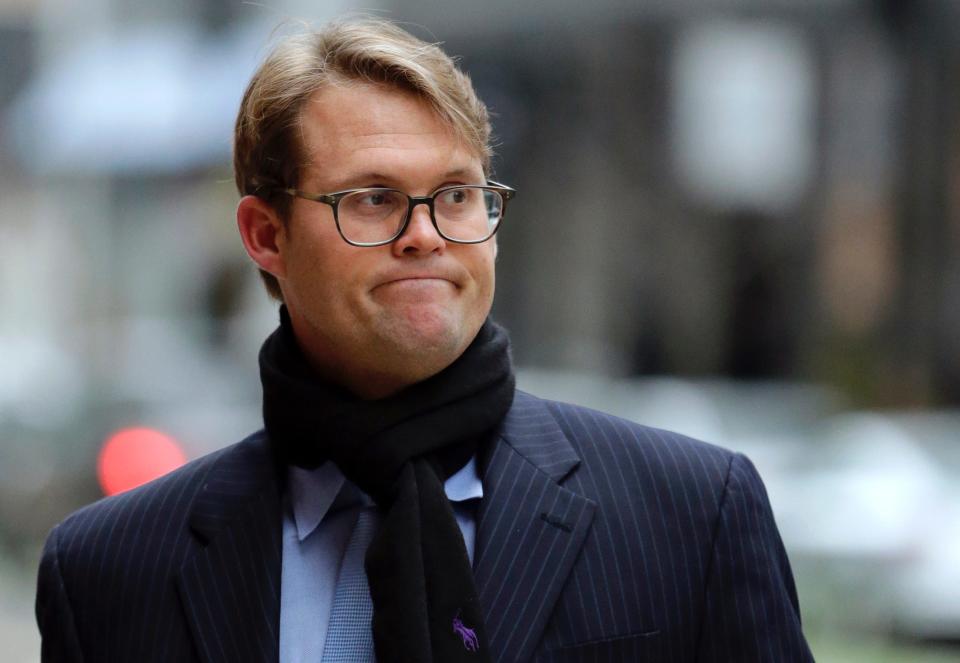 Mark Riddell arrives at federal court in Boston on April 12, 2019.