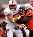 CORVALLIS, OR - NOVEMBER 5: Running back Tyler Gaffney #25 of the Stanford Cardinal is tackled by safety Lance Mitchell #10 and linebacker Rueben Robinson #13 of the Oregon State Beavers on November 5, 2011 at Reser Stadium in Corvallis, Oregon. Stanford won the game 38-13. (Photo by Craig Mitchelldyer/Getty Images)