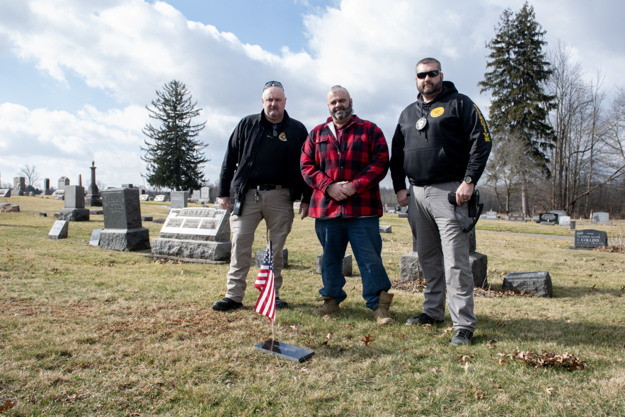 Paris Township trustee Ed Samec, center, worked to get a headstone for David Kaziateck after an investigation by Portage County Sheriff's detectives Trent Springer and Karl Balasz led to Kaziateck's identification as the John Doe buried in Hawley Cemetery since 1988.