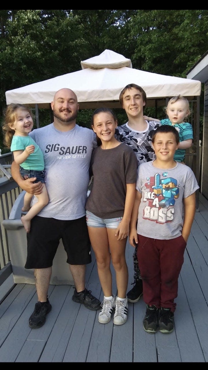Josh Aube of Somersworth with his five children, left to right, holding Sawyer, 5; Taylor, 15; Michael, 18; Josh Jr., 14; and Wyatt, 4.