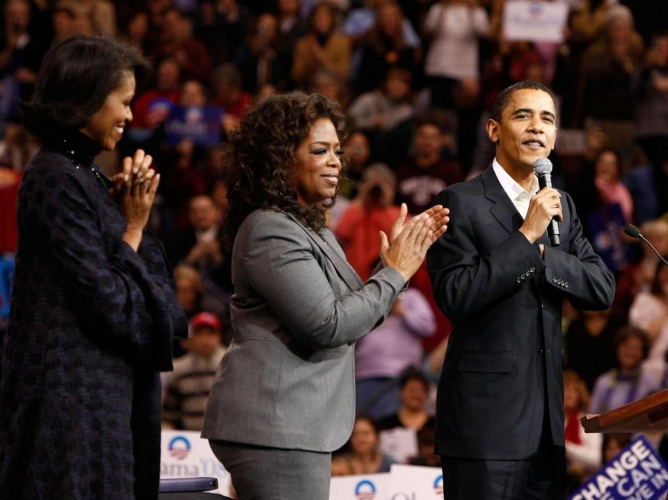 PHOTO: Oprah Winfrey (center) joins Presidential Candidate Barack Obama (right) and his wife Michelle Obama onstage during a rally held at the Verizon Wireless Arena in Manchester, New Hampshire on Dec. 9, 2007 in New York City. (Jemal Countess/WireImage/Getty Images, FILE)