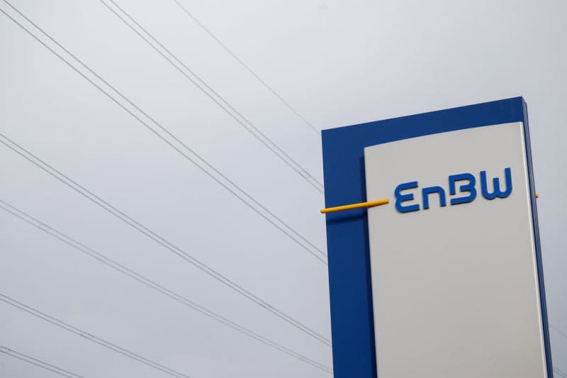 The logo of the energy company EnBW can be seen on a display. EnBW publishes its balance sheet for the past year. Marijan Murat/dpa