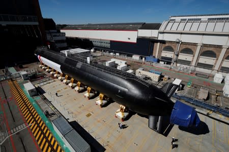 The French Navy vessel called "Suffren", first of the nuclear Barracuda class attack submarines, leaves the workshops of its construction at the Naval Group site in Cherbourg