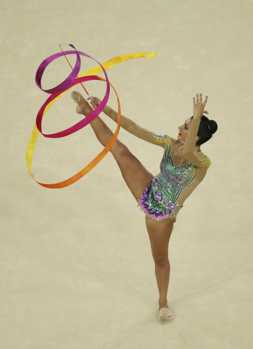 <p>Varvara Filiou (GRE) of Greece competes using the ribbon. (Reuters) </p>