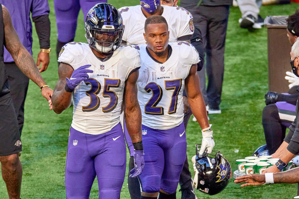 INDIANAPOLIS, IN - NOVEMBER 08: Baltimore Ravens running back Gus Edwards (35) and Baltimore Ravens running back J.K. Dobbins (27) look on  in action during a NFL game between the Indianapolis Colts and the Baltimore Ravens on November 08, 2020 at Lucas Oil Stadium in Indianapolis, IN. (Photo by Robin Alam/Icon Sportswire via Getty Images)