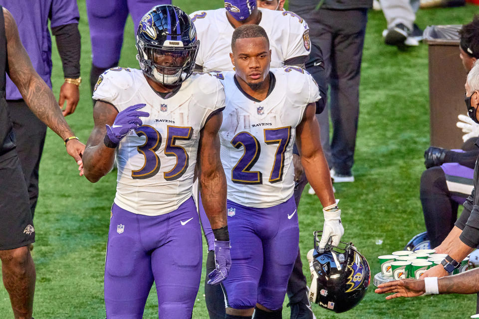 INDIANAPOLIS, IN - NOVEMBER 08: Baltimore Ravens running back Gus Edwards (35) and Baltimore Ravens running back J.K. Dobbins (27) look on in action during a NFL game between the Indianapolis Colts and the Baltimore Ravens on November 08, 2020 at Lucas Oil Stadium in Indianapolis, IN. (Photo by Robin Alam/Icon Sportswire via Getty Images)