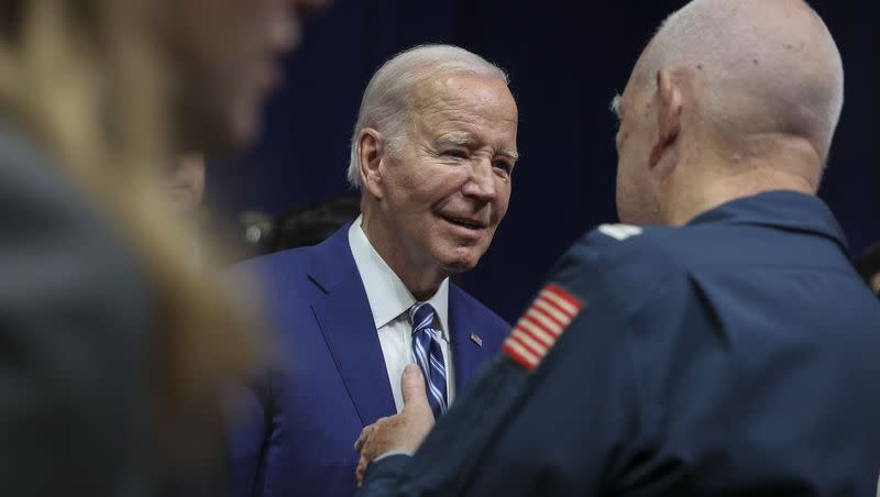 President Joe Biden speaks with Vietnam War veteran Glenn Wright after delivering remarks on the one-year anniversary of passage of the PACT Act, the most significant expansion of benefits and services for toxic-exposed veterans and survivors in over 30 years, at the George E. Wahlen Department of Veterans Affairs Medical Center in Salt Lake City on Thursday, Aug. 10, 2023.