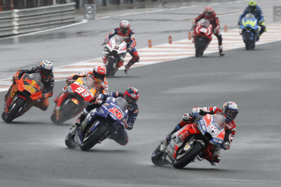 MotoGP Ducati rider Andrea Dovizioso of Italy leads the pack during the Motorcycle Grand Prix at the Ricardo Tormo circuit in Cheste near Valencia, Spain, Sunday, Nov. 18, 2018. (AP Photo/Alberto Saiz)