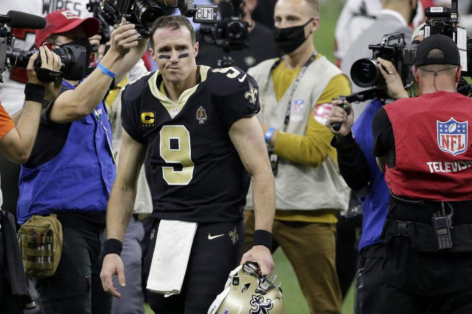 New Orleans Saints quarterback Drew Brees (9) leaves the field after an NFL divisional round playoff football game against the Tampa Bay Buccaneers, Sunday, Jan. 17, 2021, in New Orleans. The Buccaneers won 30-20. (AP Photo/Butch Dill)