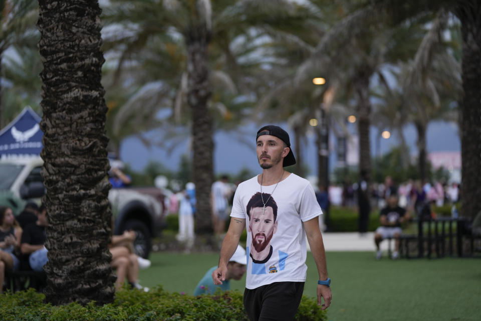 Harold Fores Vandecaveye wears a shirt supporting Inter Miami forward Lionel Messi as fans wait for gates to open for the team's Leagues Cup soccer match against Orlando City, Wednesday, Aug. 2, 2023, in Fort Lauderdale, Fla. (AP Photo/Rebecca Blackwell)