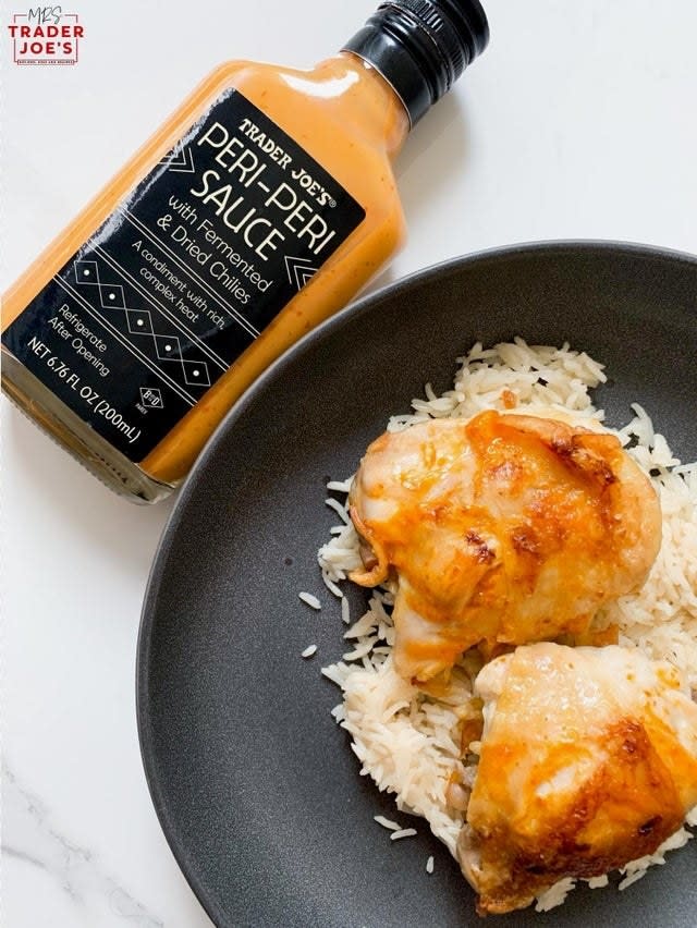 Trader Joe's Peri Peri Sauce and plated chicken thighs over rice.