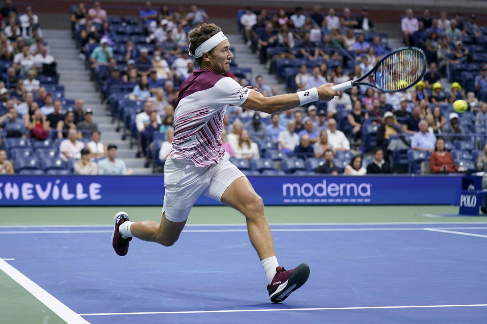 Casper Ruud, of Norway, returns a shot to Matteo Berrettini, of Italy, during the quarterfinals of the U.S. Open tennis championships, Tuesday, Sept. 6, 2022, in New York. (AP Photo/Seth Wenig)