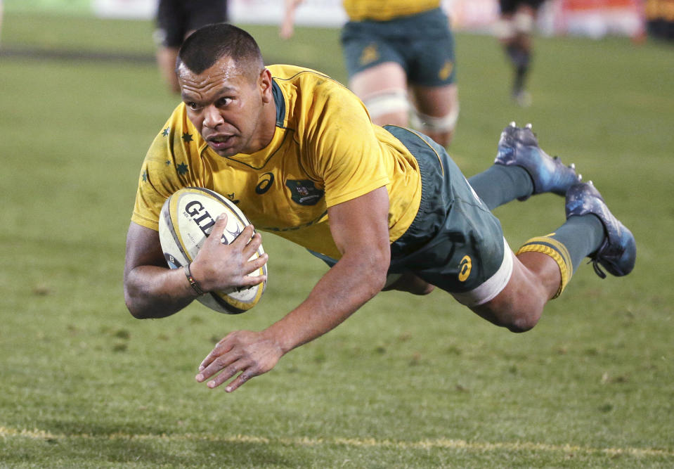 FILE - Australia's Kurtley Beale flies through the air to score a try against New Zealand during their rugby union test match in Sydney on Aug. 19, 2017. Former Wallabies playmaker Kurtley Beale has signed a short-term deal with the Western Force until the end of the Super Rugby Pacific season, the Perth-based club said on Saturday, April 6, 2024. (AP Photo/Rick Rycroft, File)