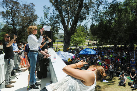 Actor and activist Jane Fonda speaks to the crowd during the People's Climate March protest for the environment in the Wilmington neighborhood in Los Angeles, California, U.S. April 29, 2017. REUTERS/Andrew Cullen