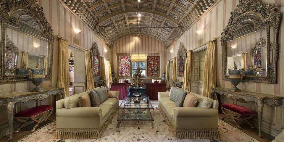 <p>The formal living room has 22-foot-high arched ceilings, which are hand-painted. </p>