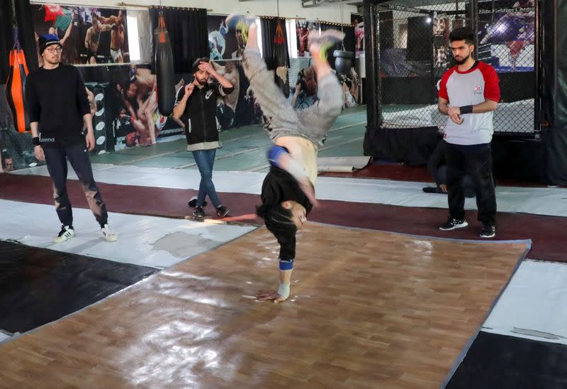 Afghan youth practise breakdancing during a training session in Kabul