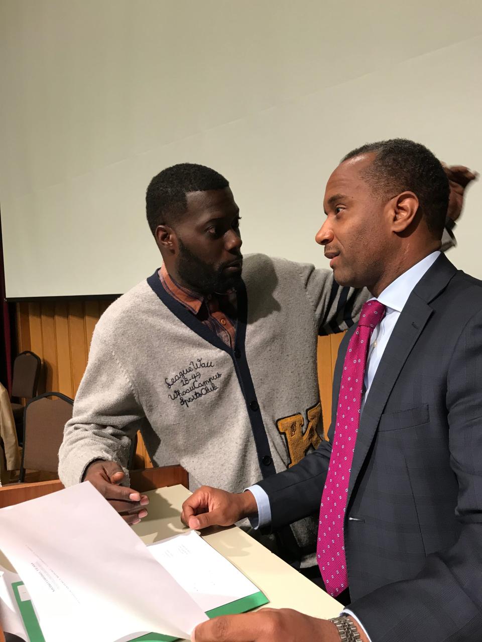 Keedran Franklin, an activist, (left) talks with Ed Stanton III, the independent monitor overseeing Memphis' compliance with the 1978 consent decree.