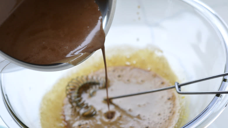 pouring chocolate into eggs